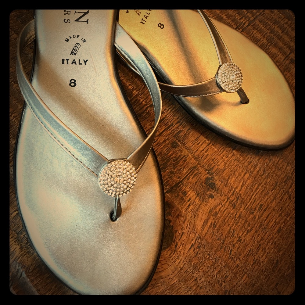 Silver sandals with Crystal-like detail.